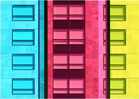 Colourful photograph in turquoise, pink and yellow showing exterior of Palais de Congres building in Montreal, Canada